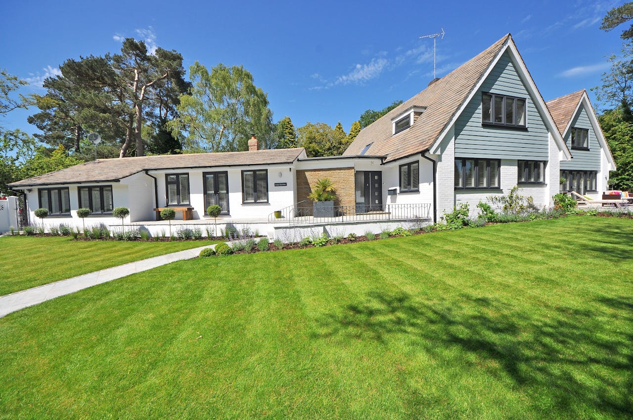 House in spring. Blown-in insulation can help keep your home comfortable all year.