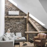 image of person in attic room with hvac mini split heat pump keeping the room cozy