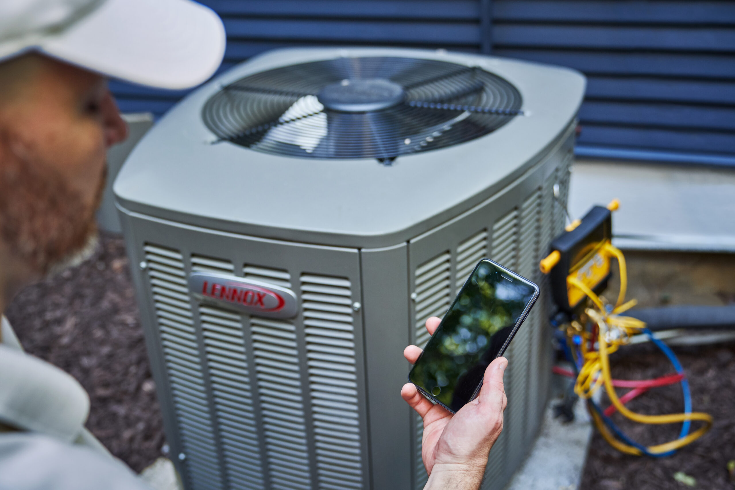 image of hvac tech performing maintenance